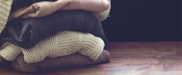 Loose-fitting clothes in a pile on the floor