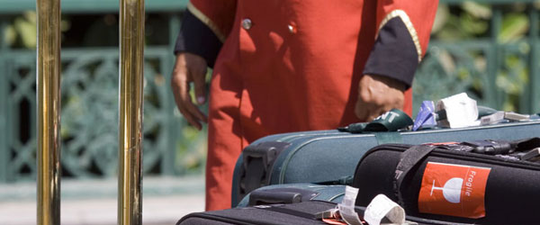 Hotel porter waiting with luggage